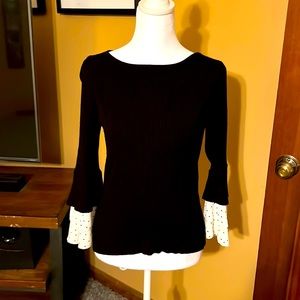 Like new WHBM black sweater with bell sleeves that have polka dots on chiffon